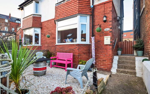 Mumbles Cottage: Flowerpot, Home, Brick, Houseplant, Yard, Brickwork, Chair, Backyard, Courtyard, Siding