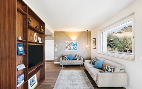 Villa Carciofa: Furniture, Interior Design, Couch, Flooring, Living Room, Wall, Television, Room, Floor, Wood