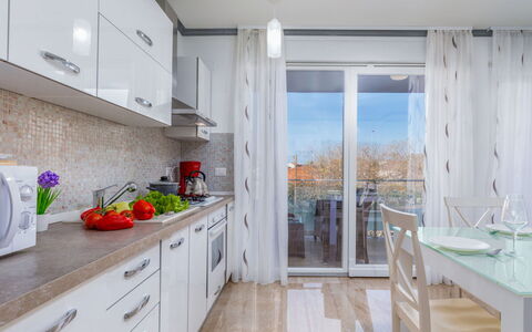 Villa Ricardo: Furniture, Interior Design, Kitchen, Flooring, Wood, Major Appliance, Countertop, Floor, Home, Ceiling