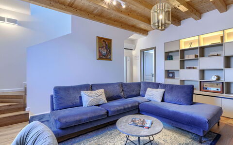 Rinata: Furniture, Interior Design, Couch, Flooring, Wood, Floor, Living Room, Room, Ceiling, Home