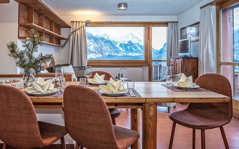 Chesa la Drosa Ab: Furniture, Ceiling, Kitchen & Dining Room Table, Chair, Hardwood, Dining Room, Alps, Wood Stain, Glacial Landform, Cabinetry