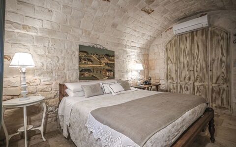 Trulli Experience, Pool, Monopoli: Furniture, Wall, Bedroom, Interior Design, Bed, Flooring, Lighting, Floor, Bedding, Bed Sheet