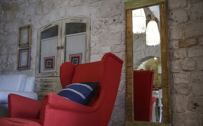 Trulletto: Furniture, Wall, Interior Design, Flooring, Chair, Floor, Lighting, Living Room, Room, Club Chair