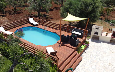 Villa Antony: Wood, Swimming Pool, Furniture, Outdoor Furniture, Wood Stain, Deck, Resort, Shade, Chair, Hardwood