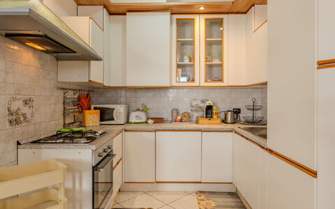 Arcobaleno House Gardalake: Kitchen Appliance, Kitchen, Countertop, Cabinetry, Major Appliance, Interior Design, Furniture, Wood, Flooring, Home Appliance