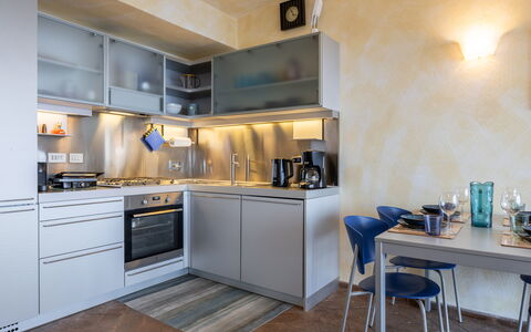 Stella Marina Apartment with Pool, Porto Santo Ste: Kitchen Appliance, Kitchen, Countertop, Major Appliance, Interior Design, Furniture, Kitchen Stove, Home Appliance, Cabinetry, Flooring