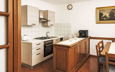 Casa Laura: Flooring, Interior Design, Cabinetry, Wood, Furniture, Kitchen, Floor, Countertop, Room, Cupboard