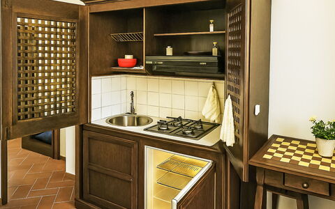 Casa Laura: Wood, Furniture, Flooring, Interior Design, Cabinetry, Floor, Kitchen, Room, Wood Stain, Kitchen Appliance