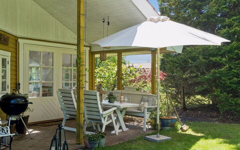 Holmfridur - 1.1Km from the Sea: Furniture, Porch, Chair, Garden, Shade, Outdoor Furniture, Cottage, Roof, Home