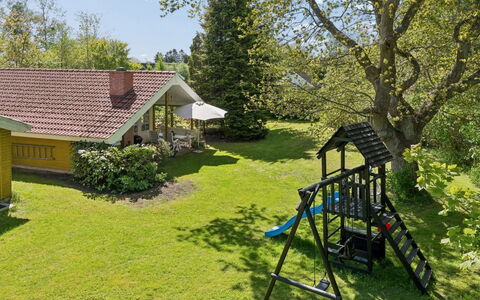 Holmfridur - 1.1Km from the Sea: Grass, House, Shrub, Cottage, Home, Garden, Roof, Lawn, Land Lot, Groundcover