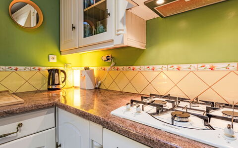 Girofla: Kitchen, Countertop, Major Appliance, Interior Design, Kitchen Appliance, Flooring, Kitchen Stove, Cabinetry, Stove, Floor