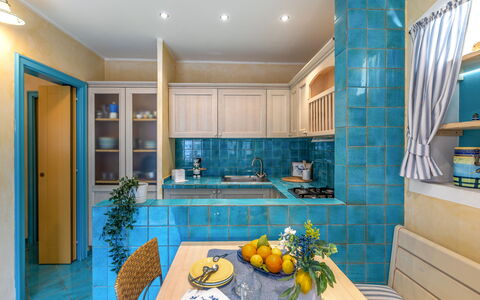 Suite la Torre: Interior Design, Flooring, Furniture, Kitchen, Floor, Countertop, Ceiling, Room, Lighting, Cabinetry