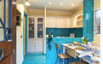 Suite la Torre: Interior Design, Flooring, Furniture, Kitchen, Floor, Countertop, Ceiling, Room, Lighting, Cabinetry