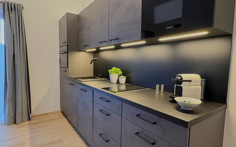 Glacier Loft Kitzsteinhorn 1: Countertop, Kitchen, Cabinetry, Interior Design, Flooring, Kitchen Appliance, Major Appliance, Furniture, Drawer, Home Appliance
