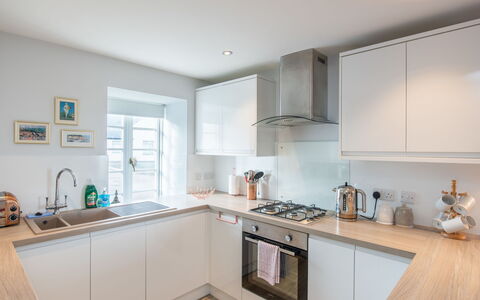 Marina View: Kitchen, Countertop, Kitchen Appliance, Interior Design, Major Appliance, Cabinetry, Flooring, Wood, Floor, Ceiling