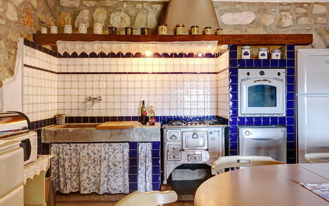 Villa Erta: Kitchen, Interior Design, Flooring, Kitchen Stove, Room, Countertop, Tile, Kitchen Appliance, Stove, Wood Stain