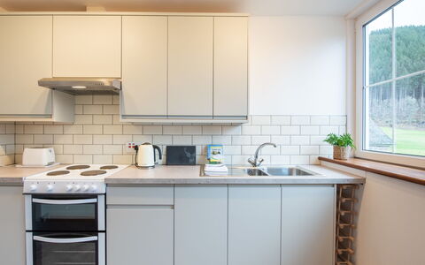 Pond View on Aigas Golf Course: Kitchen Appliance, Kitchen, Countertop, Cabinetry, Major Appliance, Flooring, Interior Design, Furniture, Wood, Home Appliance