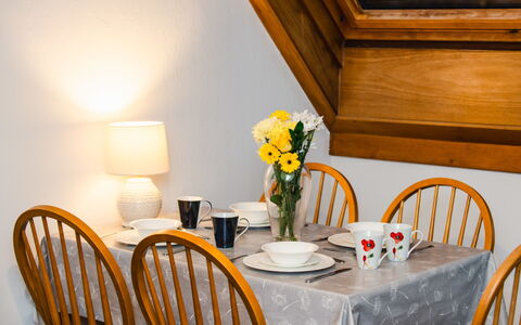 Pond View on Aigas Golf Course: Furniture, Flower, Interior Design, Wood, Yellow, Table, Textile, Dining Room, Tablecloth