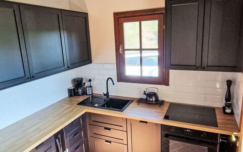 Nido di Falco: Kitchen, Furniture, Wood, Flooring, Cabinetry, Countertop, Kitchen Appliance, Interior Design, Floor, Major Appliance