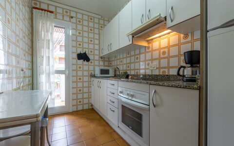 Balandro: Kitchen, Flooring, Major Appliance, Countertop, Wood, Floor, Kitchen Appliance, Interior Design, Cabinetry, Room