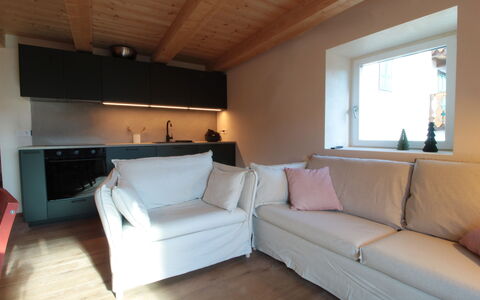 Casa Tomà Mountain View Cortina: Furniture, Flooring, Interior Design, Floor, Couch, Wood, Room, Wood Flooring, Living Room, Table
