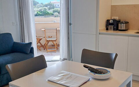 Smeralda Apartment: Furniture, Interior Design, Flooring, Chair, Table, Floor, Wood, Kitchen & Dining Room Table, Dining Room, Lighting