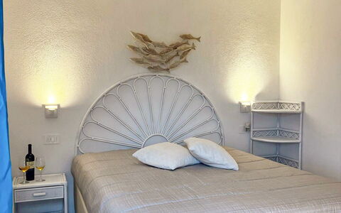 Smeralda Apartment: Bed, Bedroom, Bedding, Bed Sheet, Furniture, Interior Design, Wood, Linens, Floor, Flooring