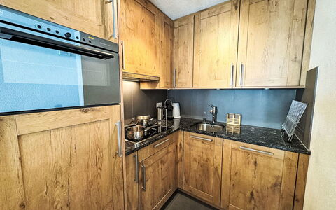 Verte-Rive: Cabinetry, Wood Stain, Drawer, Hardwood, Countertop, Cupboard, Plywood, Plank, Wood Flooring, Kitchen