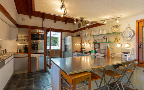 Isa Villa: Kitchen, Furniture, Countertop, Interior Design, Flooring, Light Fixture, Cabinetry, Wood, Ceiling, Lighting