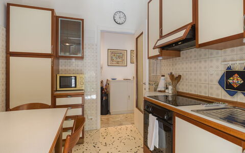 Elide: Flooring, Wood, Floor, Interior Design, Kitchen, Countertop, Furniture, Major Appliance, Room, Cabinetry