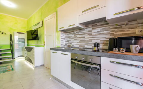 Parigi: Flooring, Interior Design, Floor, Countertop, Wood, Kitchen, Furniture, Ceiling, Lighting, Major Appliance