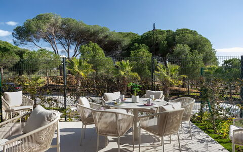 Cala Serena Village: Furniture, Outdoor Furniture, Chair, Outdoor Table, Garden, Shade, Landscaping, Patio, Yard, Backyard