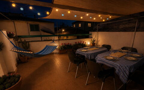 Town Plaza Palafrugell: Furniture, Chair, Outdoor Table, Kitchen & Dining Room Table, Restaurant, Tablecloth, Houseplant, Balcony, Awning, Coffee Table
