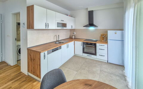Marija: Flooring, Countertop, Cabinetry, Floor, Kitchen, Interior Design, Wood, Furniture, Major Appliance, Ceiling