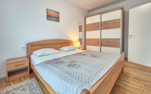 Marija: Bed, Furniture, Bedroom, Interior Design, Bedding, Bed Sheet, Flooring, Floor, Room, Wood