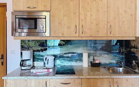 Sankt Michael im Lungau 100: Kitchen, Countertop, Cabinetry, Flooring, Interior Design, Kitchen Appliance, Kitchen Sink, Drawer, Plumbing Fixture, Wood Stain
