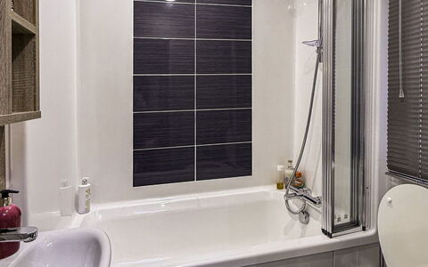 Lighthouse View: Bathroom, Plumbing Fixture, Toilet Seat, Bathtub, Toilet, Flooring, Interior Design, Floor, Sink, Tap