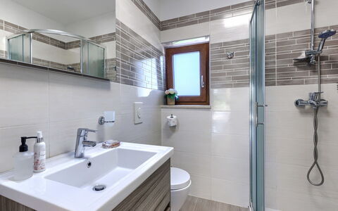 Villa Križanci: Bathroom, Plumbing Fixture, Flooring, Sink, Interior Design, Bathroom Sink, Floor, Tap, Bathroom Cabinet, Mirror