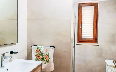 Villa Križanci: Flooring, Floor, Plumbing Fixture, Bathroom, Interior Design, Plumbing, Tap, Mirror, Sink, Room