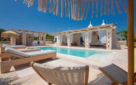 Trulli Valle D'Itria - Martina Franca: Swimming Pool, Shade, Column, Resort, Outdoor Structure, Villa, Courtyard, Outdoor Furniture