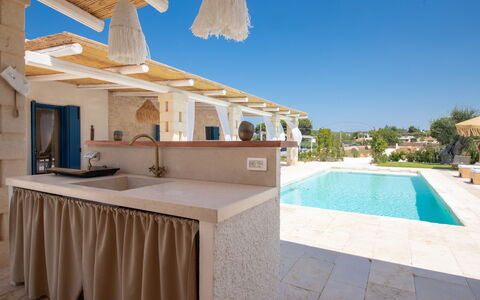 Trulli Valle D'Itria - Martina Franca: Furniture, Swimming Pool, Resort, Shade, Chair, Outdoor Structure, Outdoor Furniture, Tile, Design, Villa