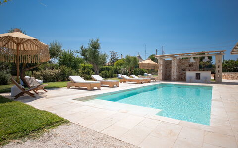 Trulli Valle D'Itria - Martina Franca: Swimming Pool, Resort, Outdoor Furniture, Shade, Flagstone, Estate, Landscaping, Umbrella, Eco Hotel, Garden
