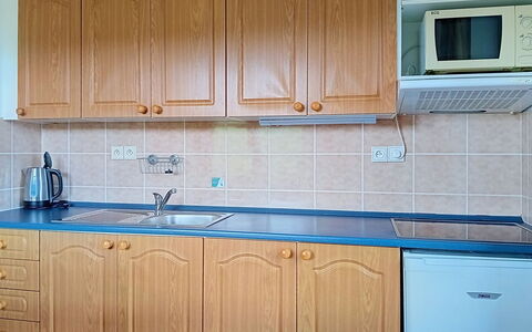 Green Valley Park Stárkov 21: Wood, Cabinetry, Flooring, Kitchen, Countertop, Kitchen Sink, Interior Design, Floor, Plumbing Fixture, Major Appliance