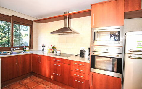 Cala Moreta: Kitchen, Cabinetry, Flooring, Wood, Major Appliance, Countertop, Kitchen Appliance, Floor, Interior Design, Furniture