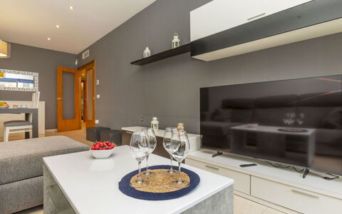Solymar: Furniture, Interior Design, Flooring, Wood, Floor, Ceiling, Room, Television, Living Room, Lighting