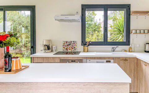 Villa Bianca: Kitchen, Countertop, Kitchen Appliance, Furniture, Interior Design, Wood, Major Appliance, Cabinetry, Flooring, Home