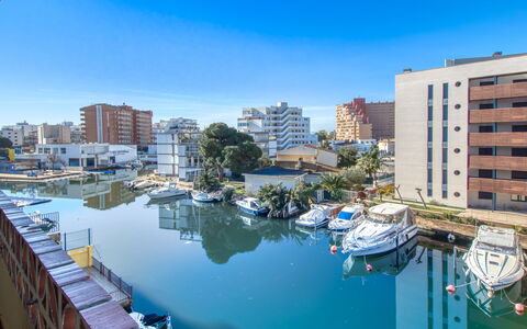 Puerto Simona: Building, Water, City, Apartment, Channel, Waterway, Boat, Urban Area, Watercraft