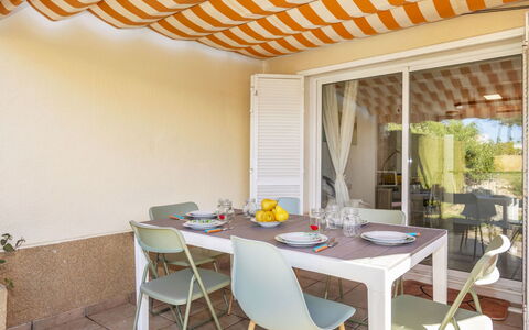Ca la Flama: Furniture, Outdoor Furniture, Chair, Table, Shade, Awning, Outdoor Structure, Kitchen & Dining Room Table, Outdoor Table, Swimming Pool