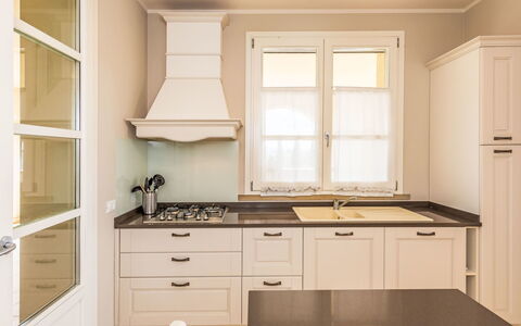 Villa Gli Olivi: Cabinetry, Kitchen, Interior Design, Flooring, Furniture, Countertop, Wood, Light Fixture, Kitchen Appliance, Ceiling