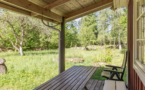 Holmen: Wood, Porch, Furniture, Shade, Cottage, Backyard, Wood Stain, Outdoor Structure, Garden, Garden Buildings